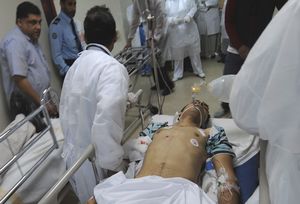 Medical staff of the Salmaniya Medical Complex rush a victim of the clashes between security forces and opposition protesters to the hospital in Manama, Bahrain Bahrain’s Secret Terror