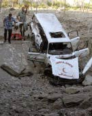 An ambulance is hit, civillians attempt a rescue Recalling Images of July 12, 2006