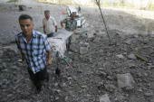 An ambulance is hit, civillians attempt a rescue Recalling Images of July 12, 2006