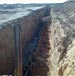 US military engineers supervise building of the “wall of death”