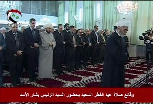 Al-Assad Appears in Eid Prayers, Refutes Claims of Convoy Attack