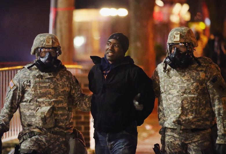 American police arresting one of Ferguson's protesters