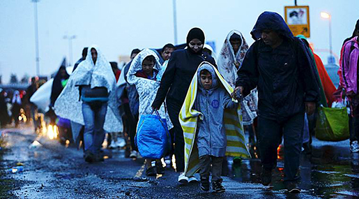 Migrants arrive at the Austrian-Hungarian border station of Hegyeshalom, Hungary