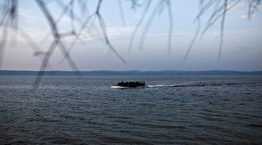 Migrants in a boat on sea