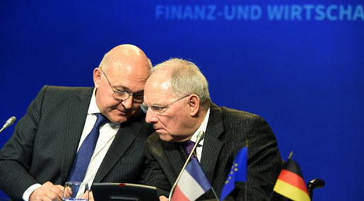 French Finance Minister Michel Sapin speaks with German Finance Minister Wolfgang Schauble