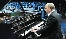 Putin Plays Song on Piano for Students