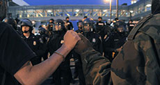 US City under Curfew, Tensions Escalate over Black Teen’s Death