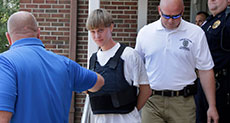 Church Massacre Suspect Held as Charleston Grieves