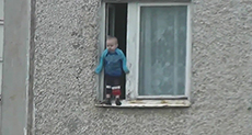 Russian Toddler Hangs Out of 8th Floor Window

