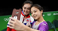 North, South Korean Gymnasts Pose for Olympic Selfie
