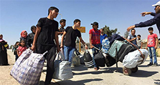 Residents Leave Area near Syrian Capital under Deal with Government
