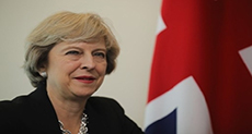 New British PM Calls for Tougher Stance on Migrants
