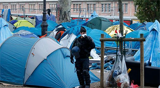 Paris Police Clear Hundreds of Migrants from Tent Camp