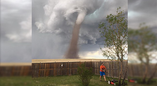 Canada Lawn-Mowing Man Defies Twister!