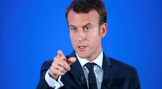 Macron: Al-Assad Will Remain in Power in Syria