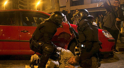 Violent Clashes Erupt Across Catalonia After Puigdemont’s Arrest