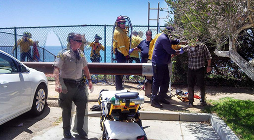 Rescuers aiding men who fell off cliff