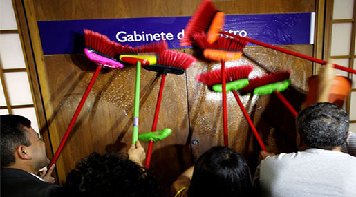 Brazilian ministry staff with brooms 