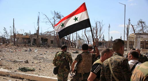 Syrian Army troops raise Syrian flag