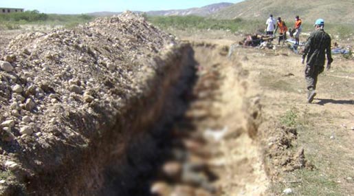 Mass graves aftermath Hurricane Matthew 