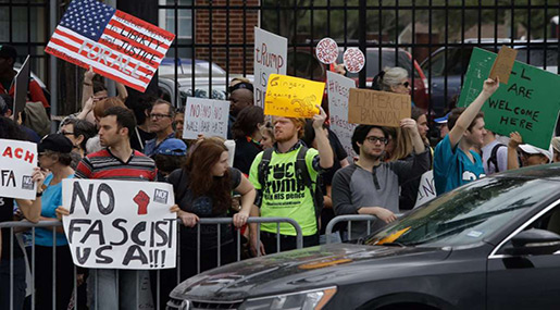 Hundreds Gather for Super Bowl Anti-Trump Protest in Houston