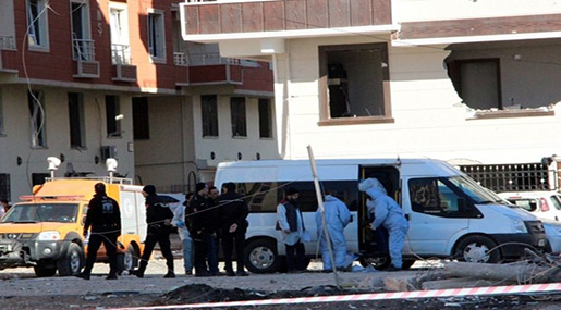 Forensics and police officers work on the blast scene after Friday's explosion 