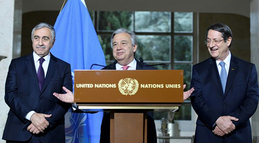 UN Secretary-General Antonio Guterres (C) next to Turkish Cypriot leader Mustafa Akinci (L) and Greek Cypriot President Nicos Anastasiades (R)