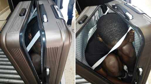 African migrant in a suitcase