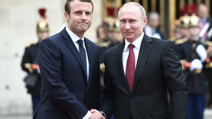 Russian President Vladimir Putin meets his French counterpart Emmanuel Macron