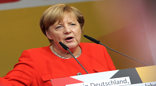 Germany: Police Investigating after Tomatoes Thrown at Chancellor Merkel Germany: Police Investigating after Tomatoes Thrown at Chancellor Merkel