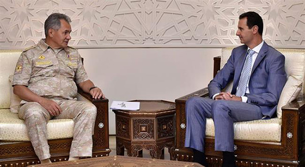 Syrian President Bashar al-Assad and Russian Defense Minister Sergei Shoigu
