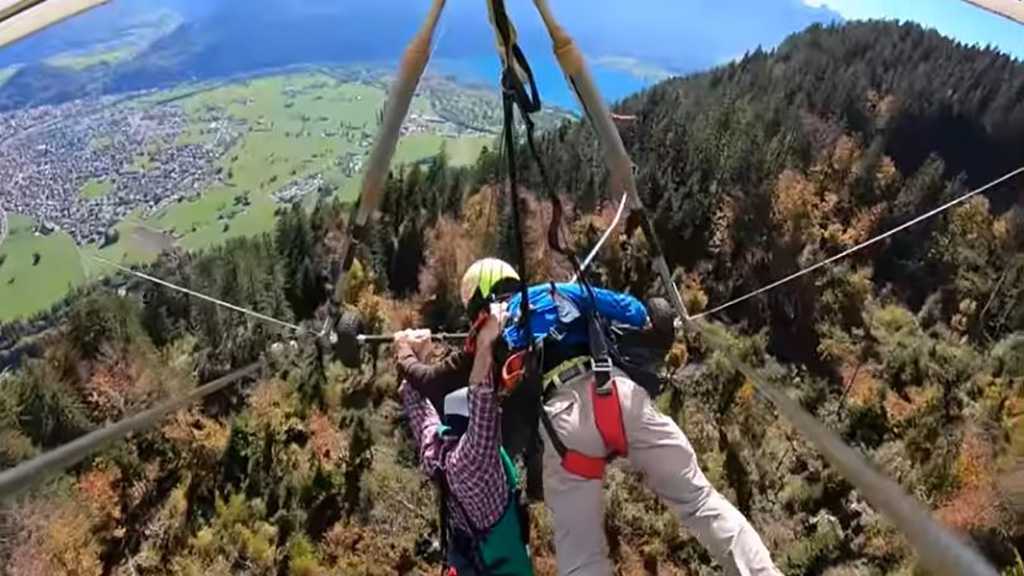 Man Hangs on to Glider at 1000+ Meters after Pilot Fails to Attach Harness
