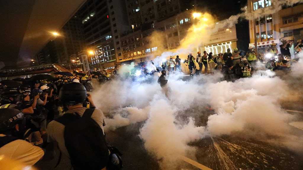 Police Fire Tear Gas in Clash with Hong Kong Protesters over Banned March