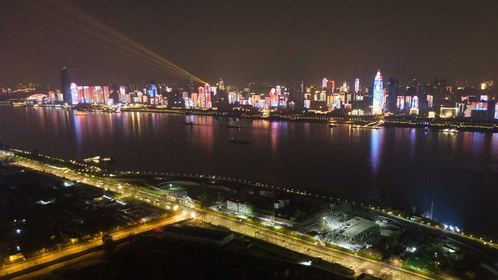 Wuhan Aglow As Outbound Travel Ban Lifted