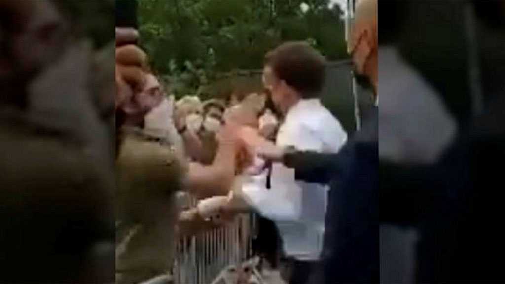 Ouch! Emmanuel Macron Slapped In the Face during Walkabout