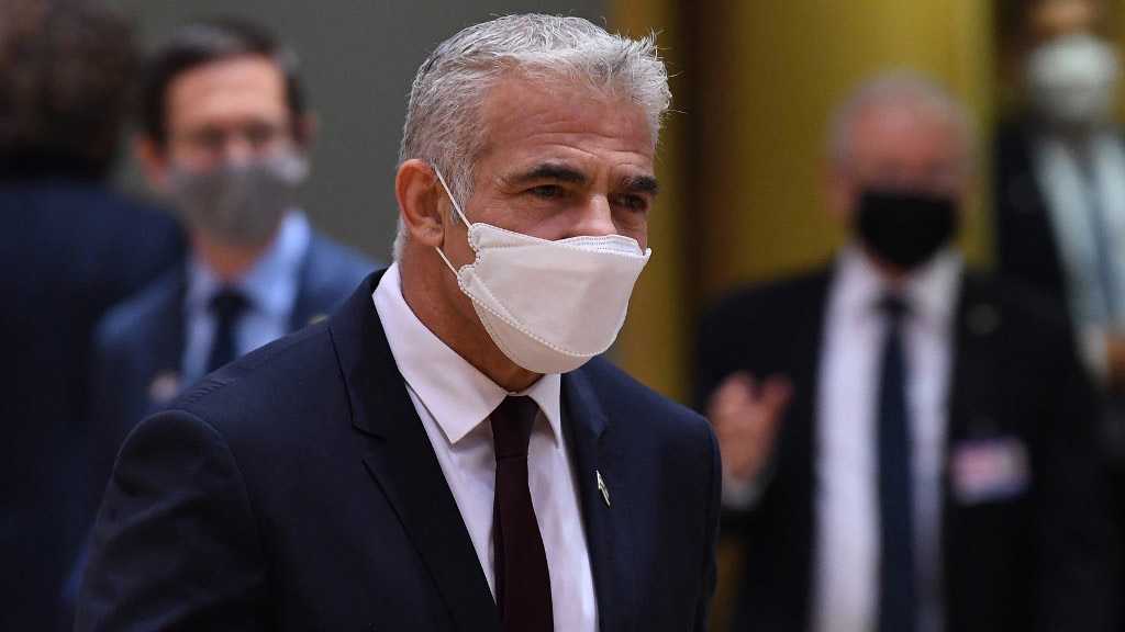 Lapid Goes into Quarantine as Aide Tests COVID-19 Positive