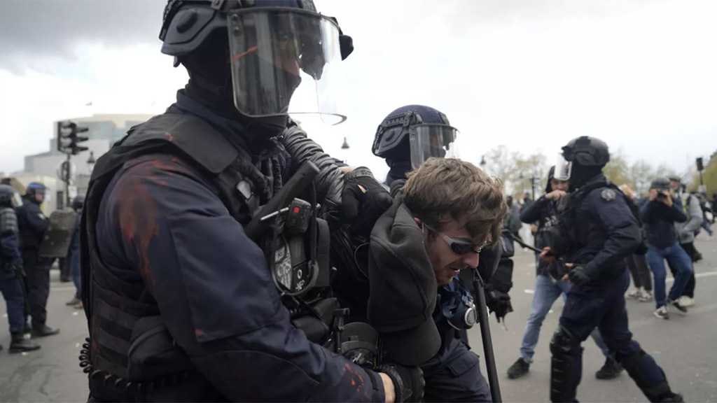 Thousands of Protesters Clash with Police as French President Defends Pension Reform